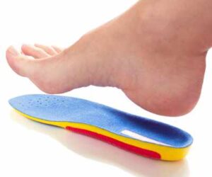 Female bare foot with full length bought insole